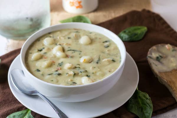 Chicken Gnocchi Soup horizontal photo with spinach and spoon