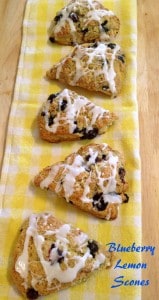 Blueberry Lemon Scones on yellow dish towel lined up