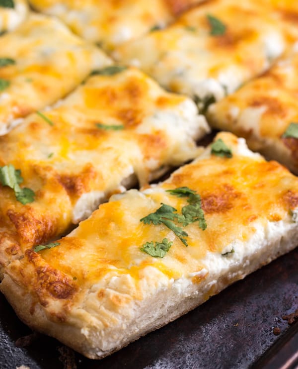 Cut breadsticks on baking pan