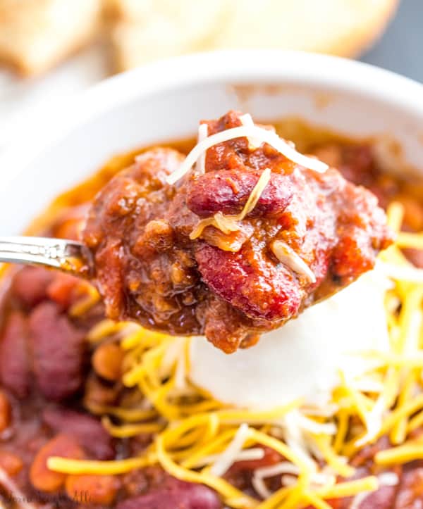 Spoonful of Sweet Heat Chili with strands of cheese on top