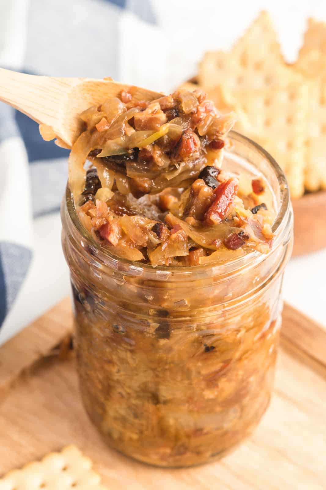 Bacon Jam in canning jar with spoon spooning some out of the top