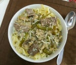 Featured image of stroganoff overhead in bowl topped with shredded cheese