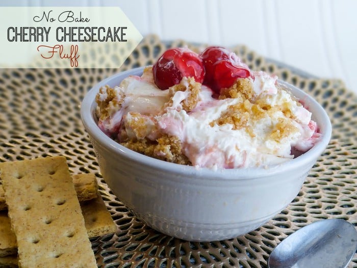 Cherry Cheesecake Fluff in small white bowl topped with cherry pie filling