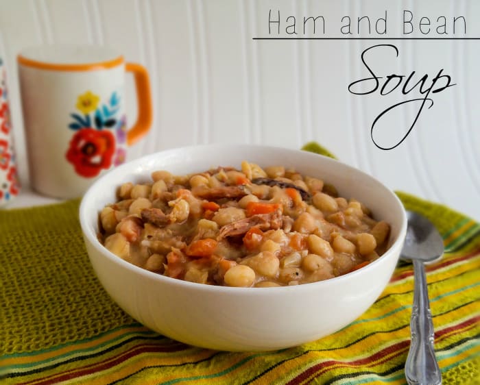 Ham and Bean Soup in white bowl on green linen with spoon beside bowl