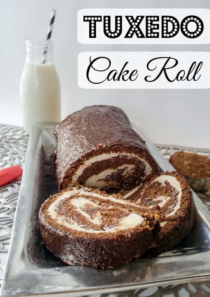 Tuxedo Cake Roll on silver platter with two slices cut from roll