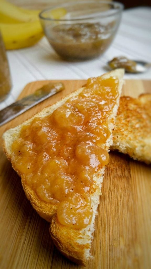 Up close of jam spread on slice of toast