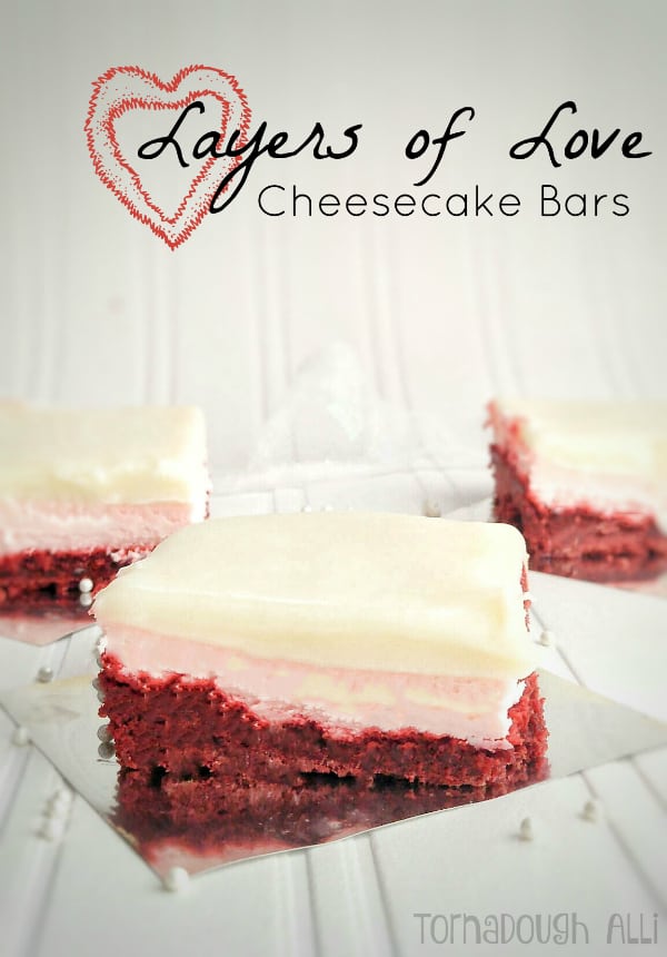 Layers of Love Cheesecake Bars on silver paper