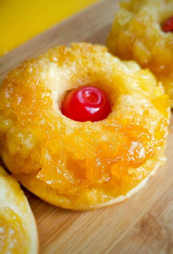 Close up of donut with cherry in center