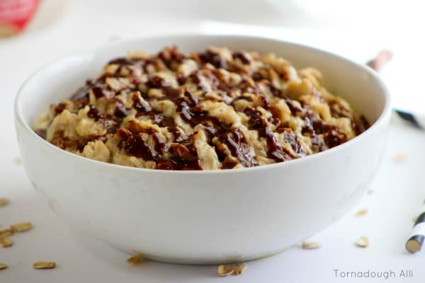 Side of oatmeal in bowl with chocolate drizzle