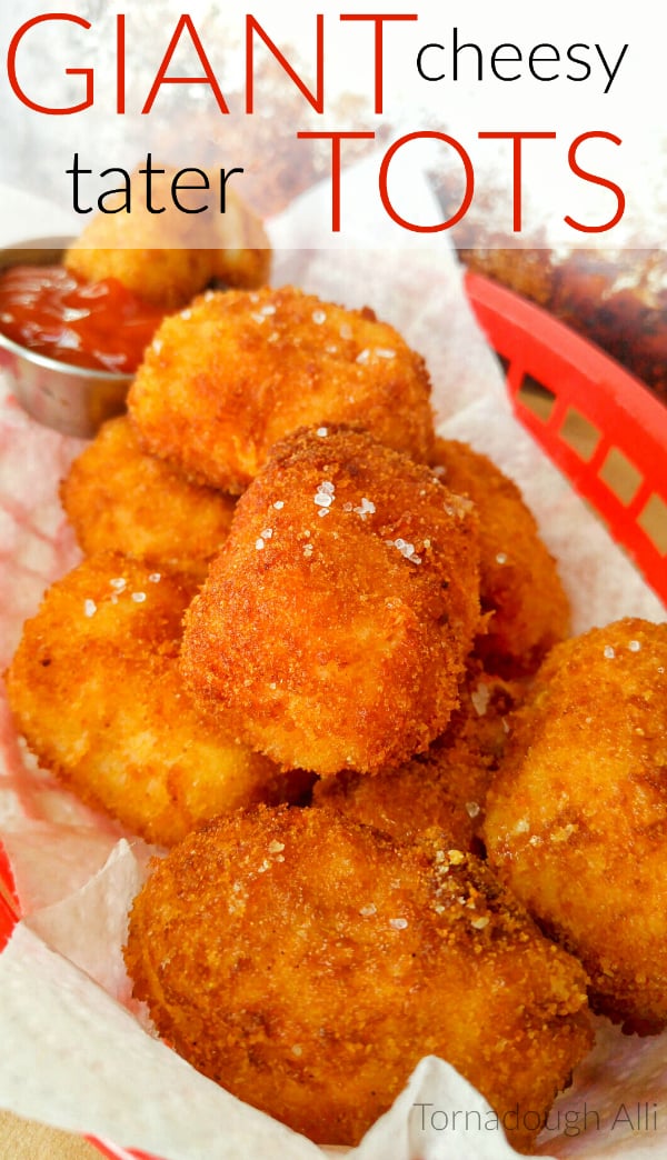 Giant Cheesy Tater Tots in. basket topped with sea salt
