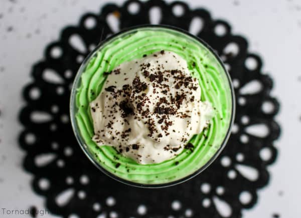 Overhead of Trifle topped with whipped cream and crushed Oreos 