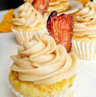 Pancake cupcake topped with maple buttercream and slice of candied bacon