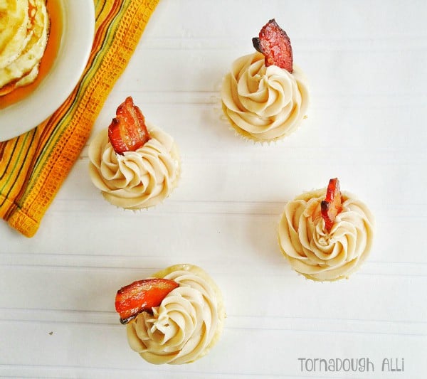 Overhead of pancake cupcakes topped with candied bacon slices