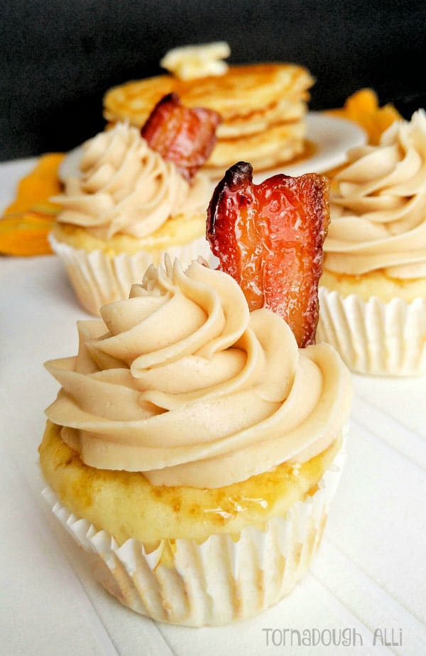 Pancake Cupcakes topped with maple buttercream and candied bacon slice