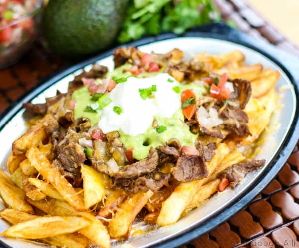 Overhead of Carne Asada Fries on silver platter