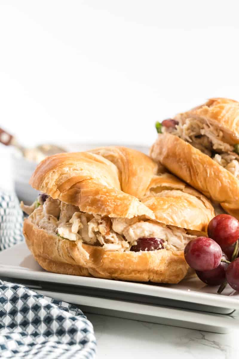 Side view of chicken salad on croissants