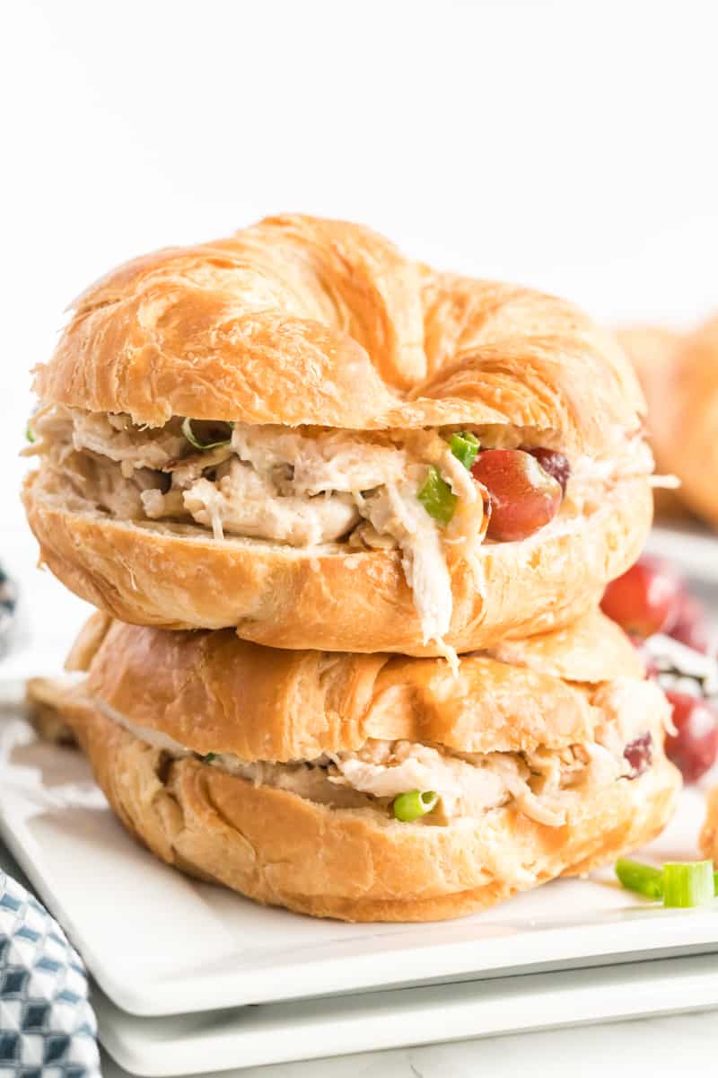 Chicken salad served on croissants stacked on top of one another