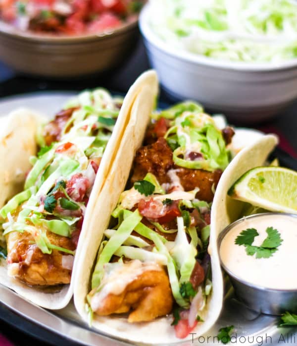 Fish Tacos with cabbage, pico de gallo and sauce 