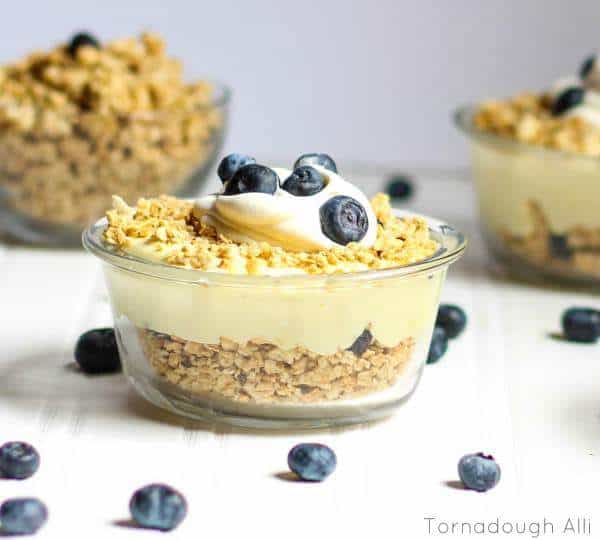 Lemon Curd Blueberry Parfaits surrounded by blueberries