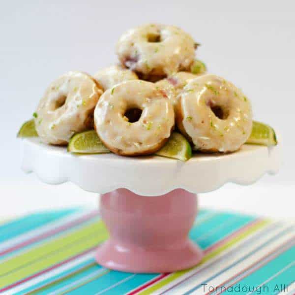 Stacked Strawberry Lime Donuts on pink and white cake stand