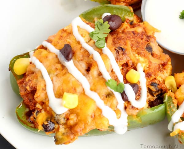 Overhead of one stuffed pepper showing melted cheese and sauce