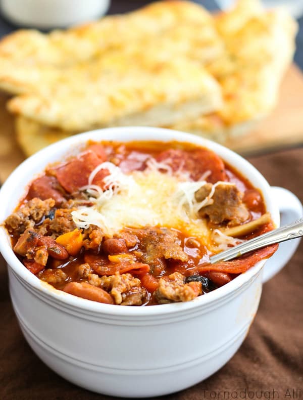 Close up of Pizza Chili with spoon in bowl