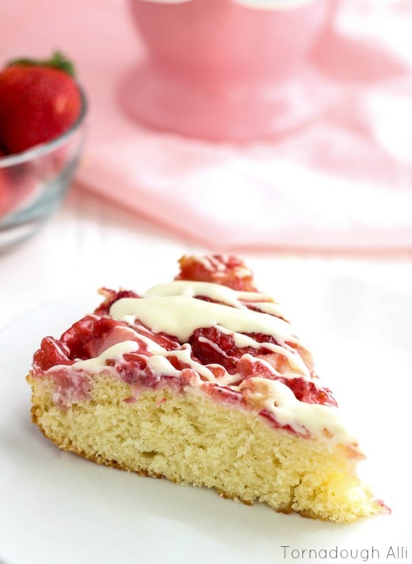 Slice of Upside Down Strawberries and  Cream Cake with Glaze