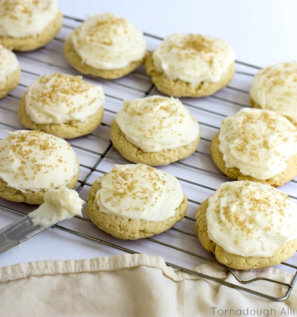 Frosted cookies cooling rack covered with gold sprinkles