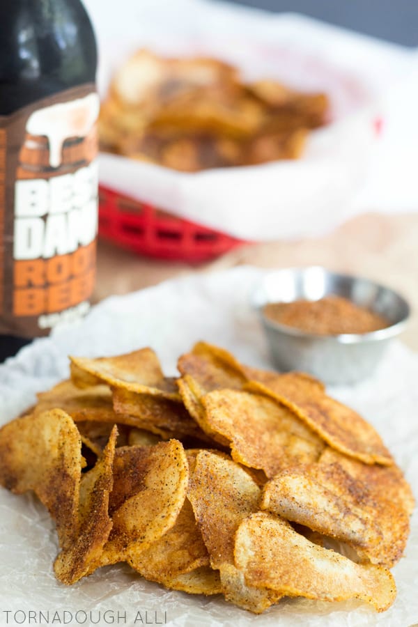 Homemade BBQ Potato Chips stacked on parchment paper