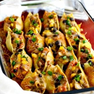 Delicious Mexican Stuffed Shells stuffed with creamy cheesy veggies and beef!