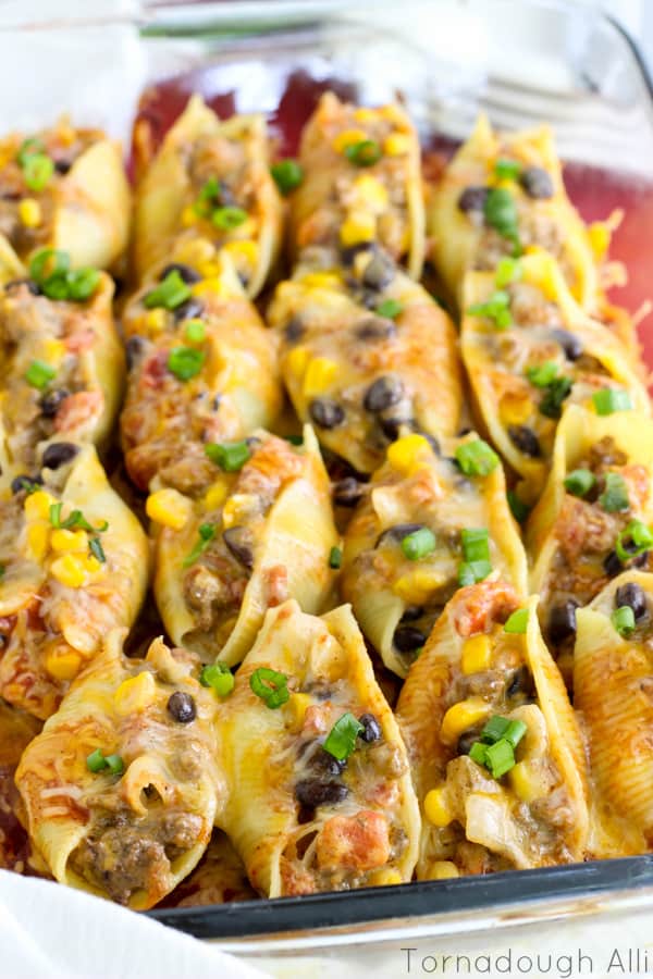 Close up of Mexican Stuffed Shells in baking dish