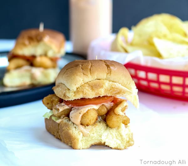 Finished Shrimp Po' Boy Sliders on parchment paper