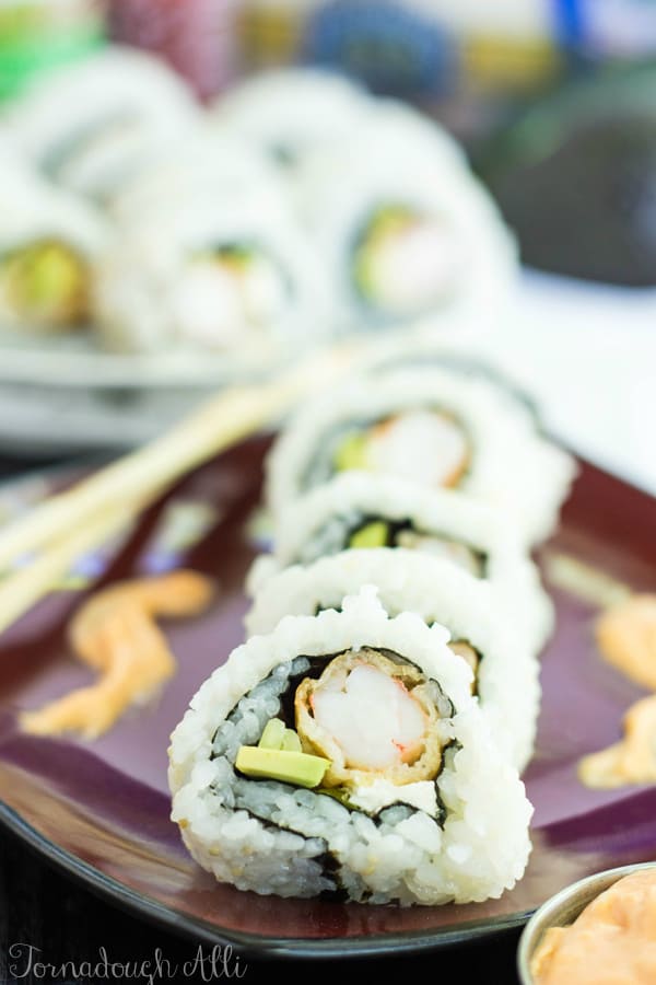 Layered cut Shrimp Tempura Rolls on red plate