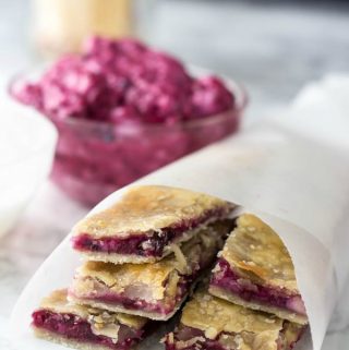 Blackberry Cream Cheese Pie Dippers in parchment paper cone