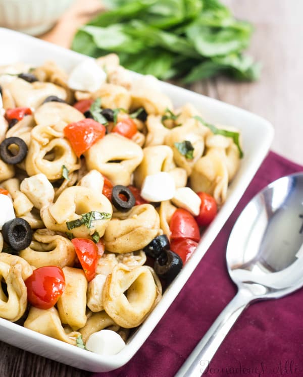 Close up of Caprese Tortellini Salad in square serving dish