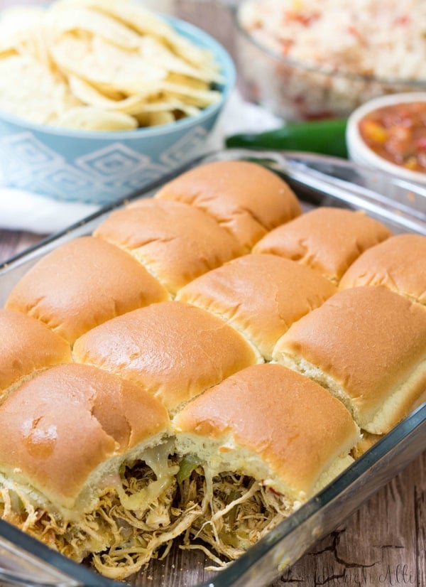 Chicken Fajita Sliders in baking dish with one removed