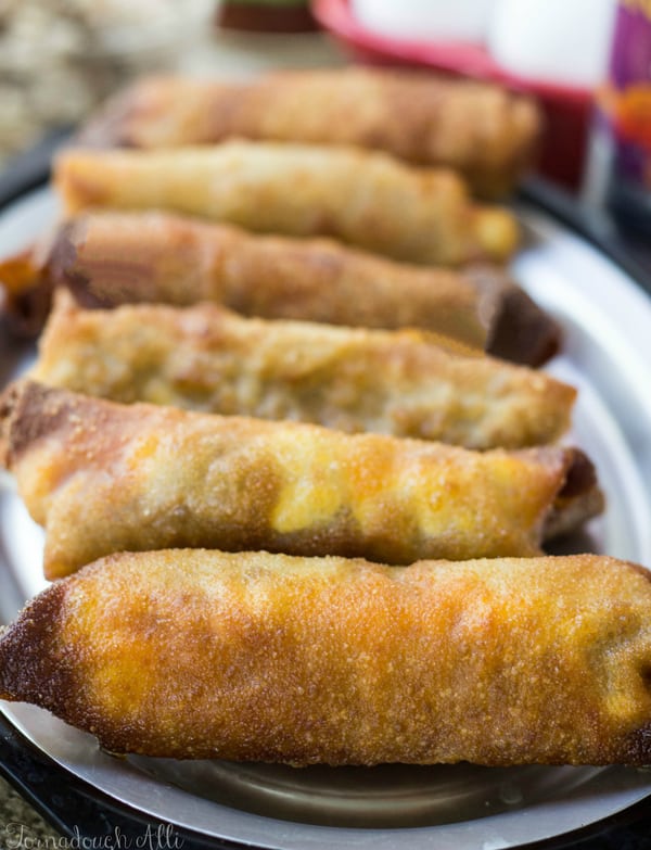 Breakfast Egg Rolls lined up on metal plate