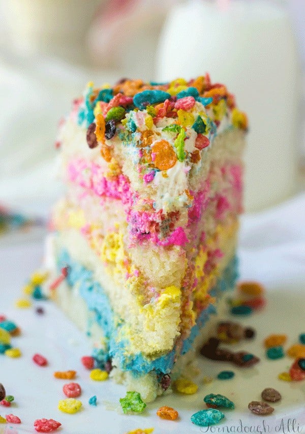 Straight on shot of Fruity Pebbles Cake showing colorful frosting layers