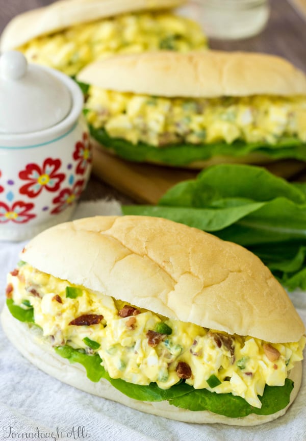 Overhead photo of finished Egg Salad Sandwich on large bun with lettuce