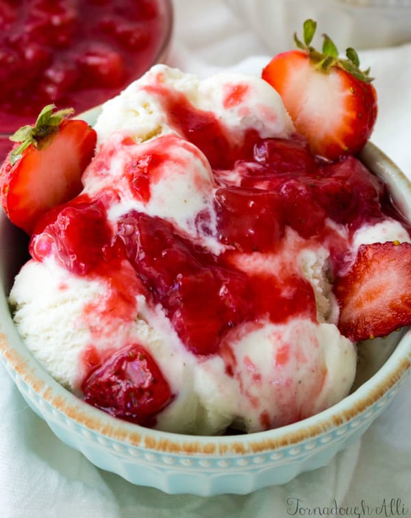 Close up of ice cream topping on ice cream with strawberries