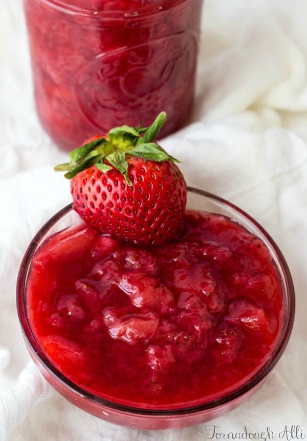 Bowl with Strawberry Banana Ice Cream Topping and whole strawberry