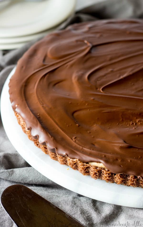 Brownie Bottom Peanut Butter Cup Tart on marble turn table