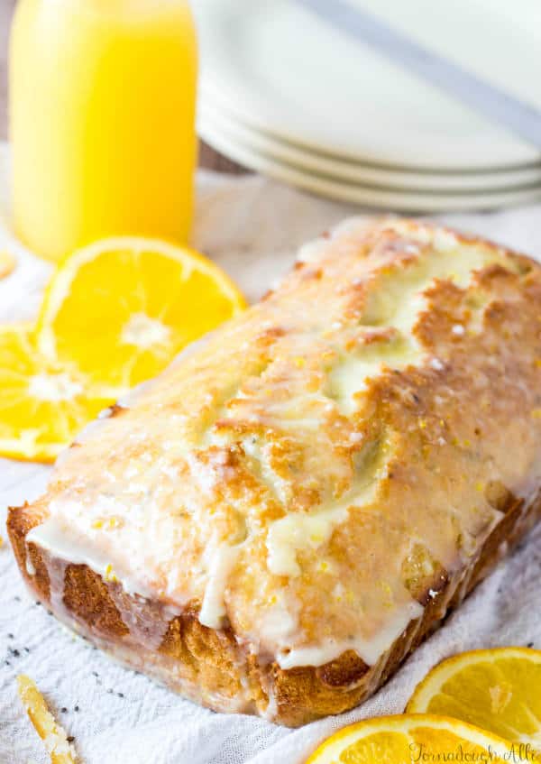 Unsliced Candied Orange Chia Seed Bread on serving platter