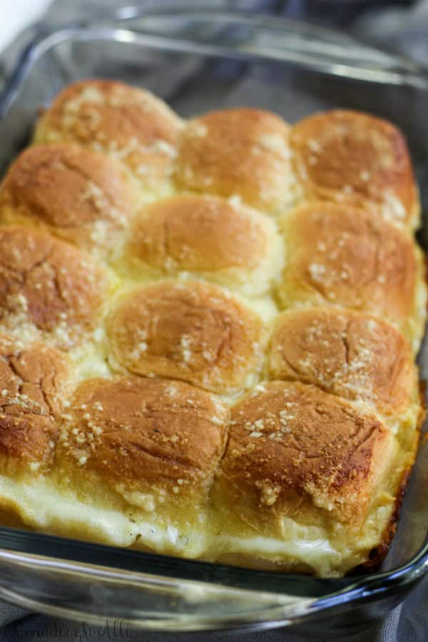 Cheesy Stuffed Garlic Bread Sliders finished in pan showing melty cheese