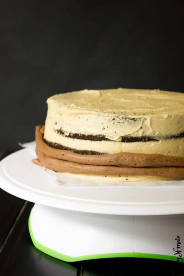 Cake being frosted on turntable