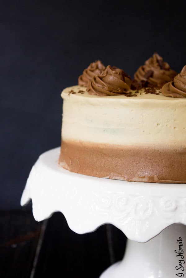 Side view of decorated cake on cake stand