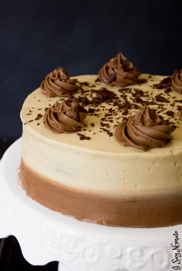 Irish Coffee Chocolate Cake on cake stand showing chocolate swirls and chocolate shavings