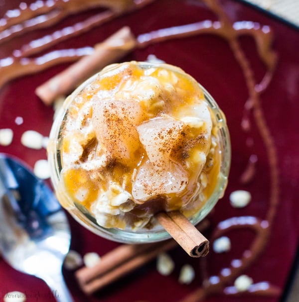 Overhead of Caramel Apple Pie Overnight Oats with cinnamon stick