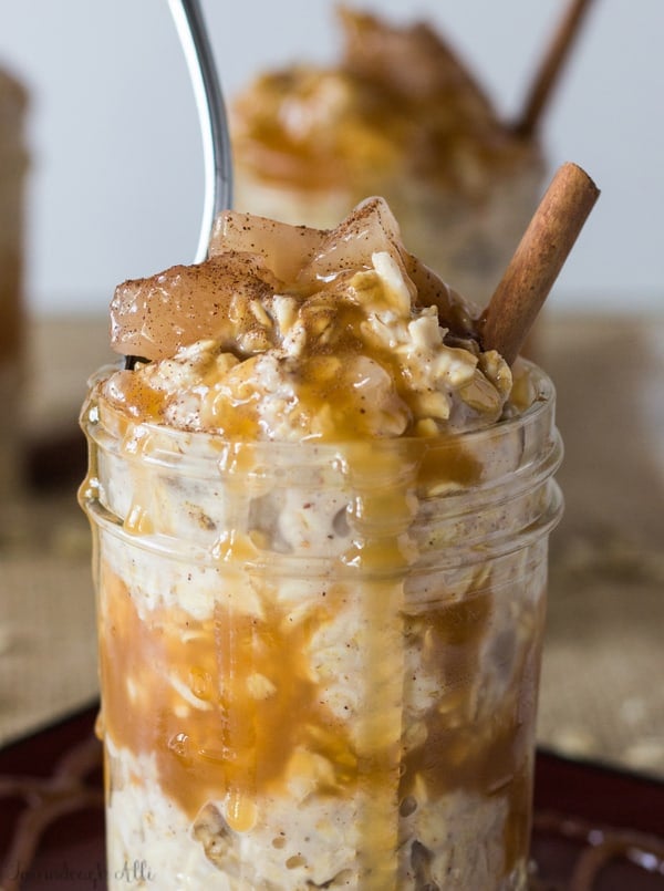 Close up of Caramel Apple Pie Overnight Oats with spoon in jar