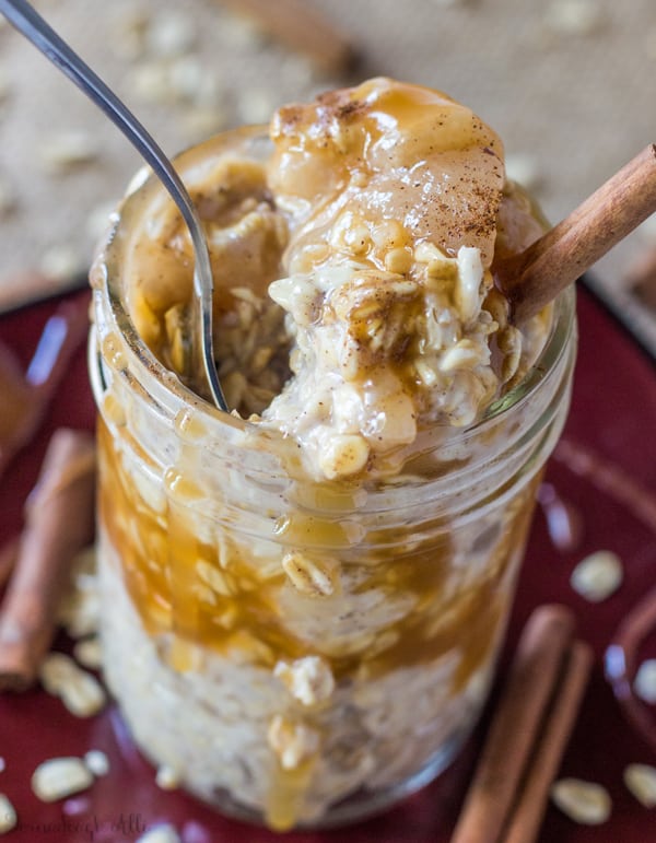 Caramel Apple Pie Overnight Oats with spoon and some missing from jar